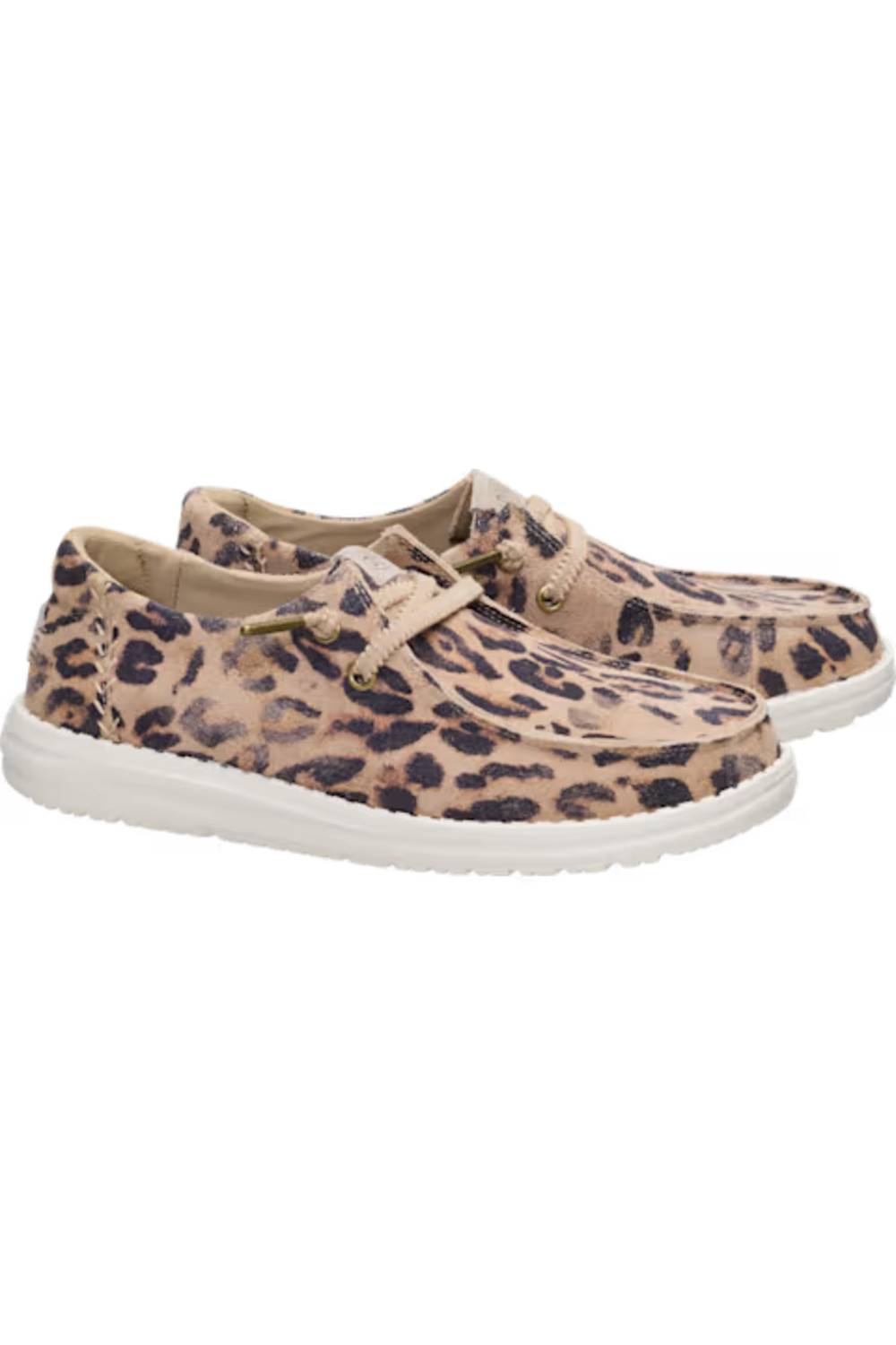 A pair of slip-on boat-style shoes featuring a beige and brown leopard print pattern with white soles, shown against a plain white background.