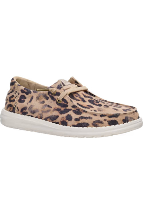A single slip-on boat shoe featuring a beige and brown leopard print upper with a thick white sole, shown against a plain white background.