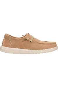 A single tan suede boat shoe with white laces and a white sole, shown in a side profile on a white background.