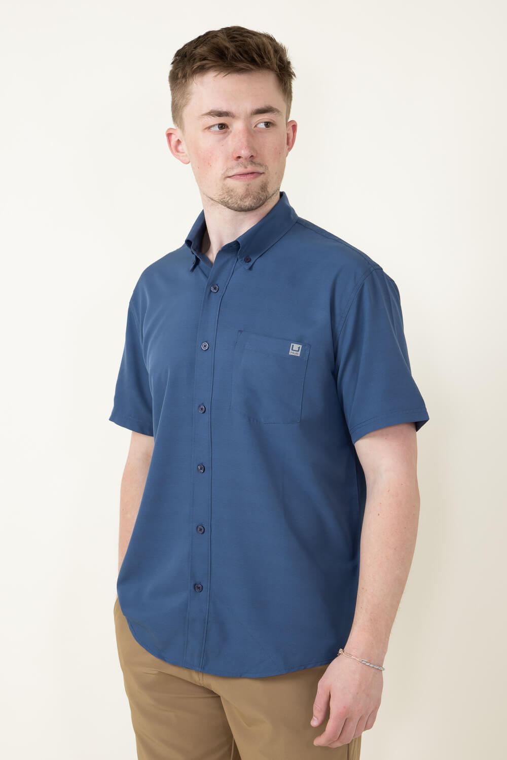 Huk Fishing Kona Cross Dye Stripe Button Down Shirt for Men in Blue