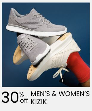 Person wearing white sneakers and red calf socks while balancing grey sneakers on the bottom of their shoes with a blue background and a promotional banner that reads 