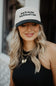 Put It On My Boyfriend’s Tab Trucker Hat for Women in Black/Tan