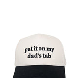 Put It On My Dad’s Tab Trucker Hat for Women in Black/Tan