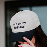 Put It On My Dad’s Tab Trucker Hat for Women in Black/Tan