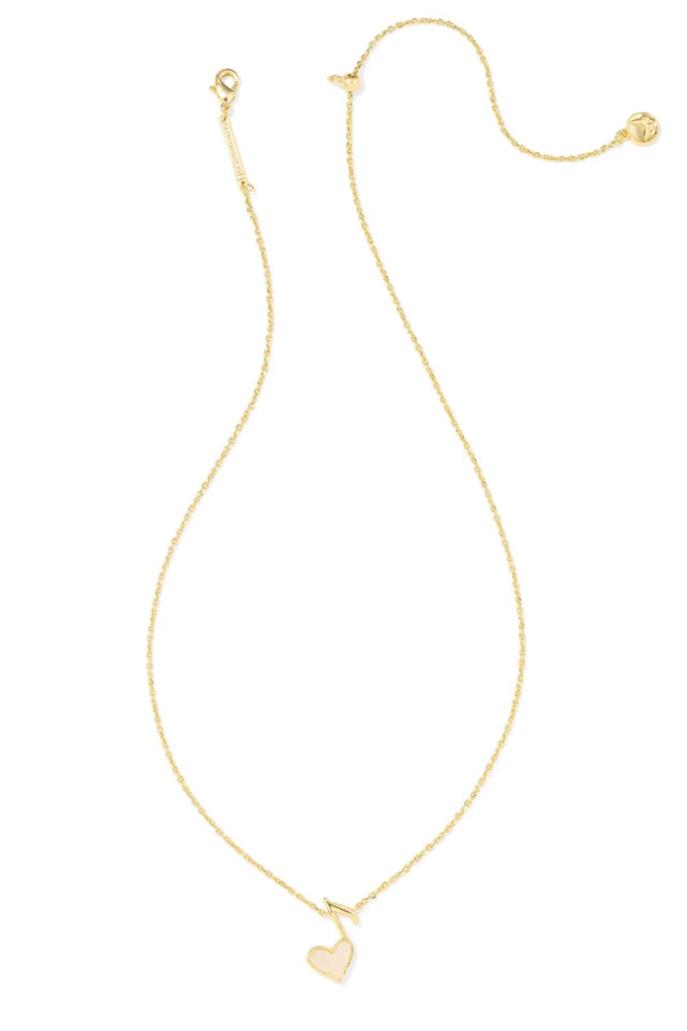 A delicate gold chain necklace featuring a small, polished gold heart pendant, displayed on a clean white background.