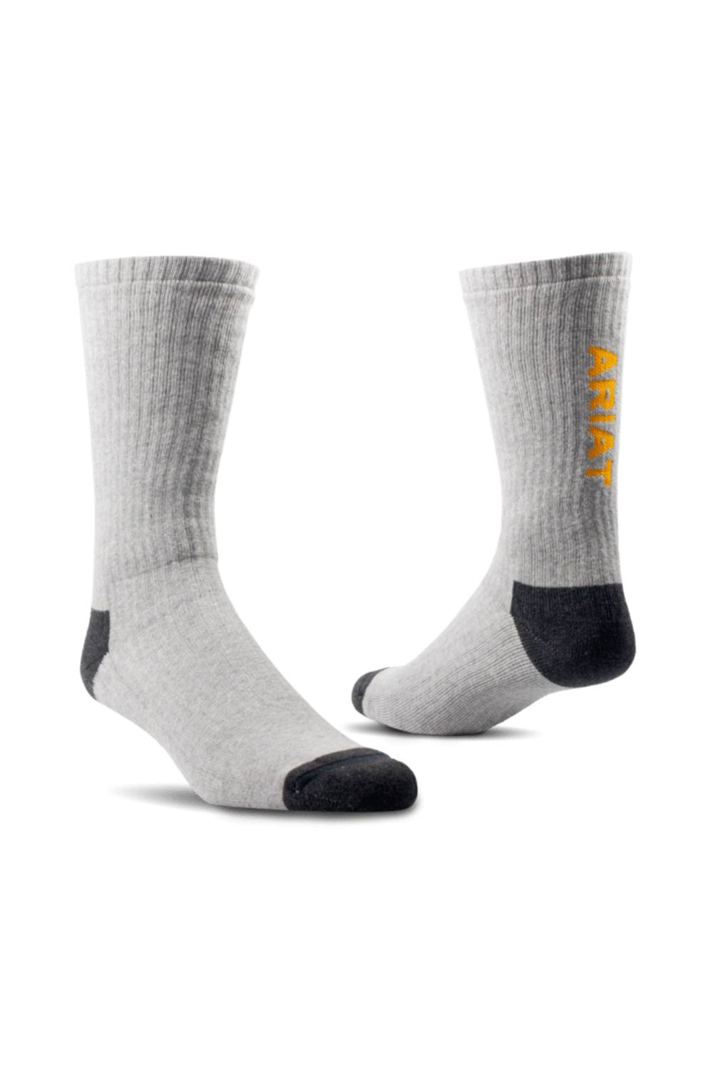 a pair of light grey socks with black heel and toe and a vertical yellow Ariat logo on the back on a all white background