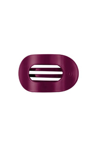 A dark  hair clip with three horizontal ventilation slots, shown on a plain white background.
