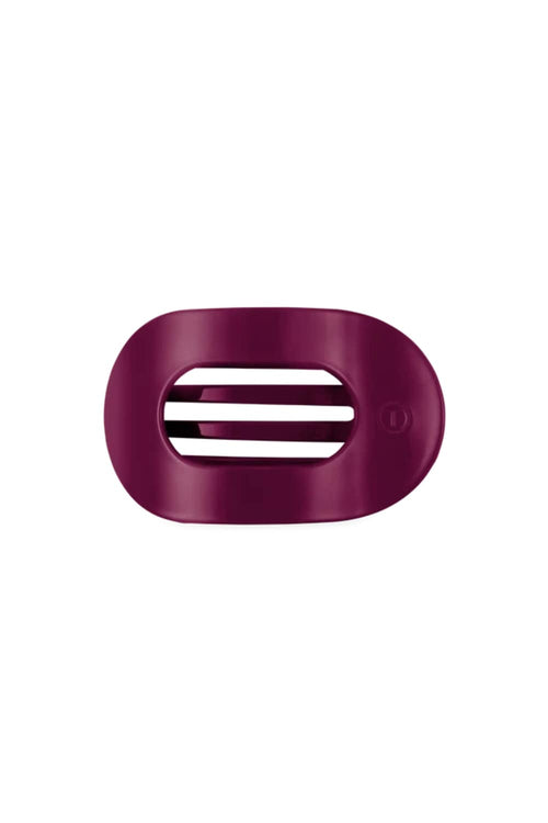 A dark  hair clip with three horizontal ventilation slots, shown on a plain white background.