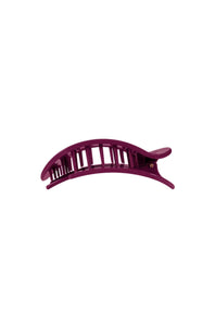 A curved hair claw clip in a deep plum purple color, shown against a plain white background.