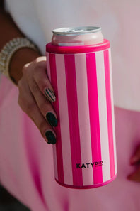Hand holding a pink and white striped can cooler with 'KATYDID' branding.