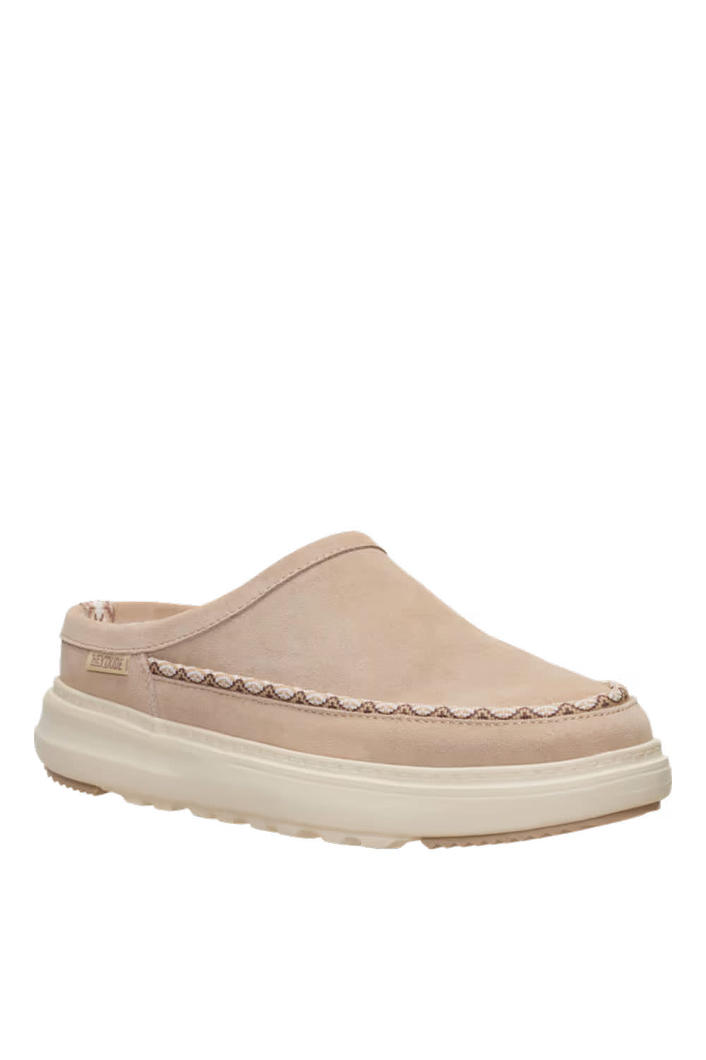 A single slip-on clog-style shoe in light beige suede with a decorative stitched border and a thick cream-colored sole, shown against a plain white background.