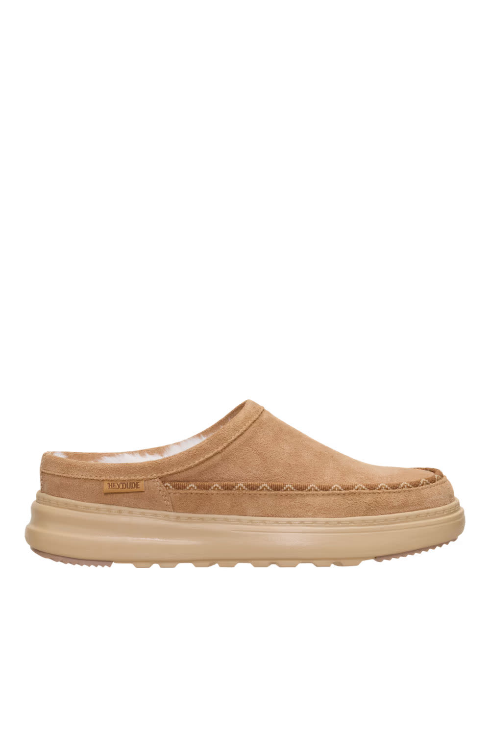 A tan suede slip-on clog shoe with a thick beige sole, shown in profile against a plain white background.
