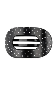 A black oval-shaped hair clip with a white polka dot pattern shown on a plain white background.