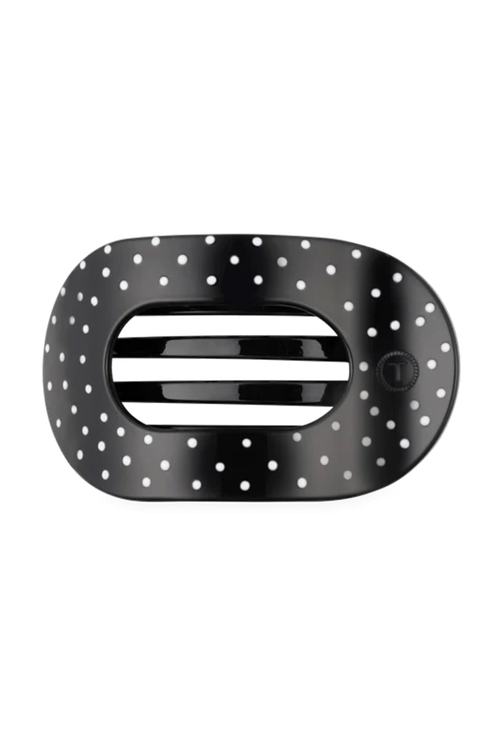 A black oval-shaped hair clip with a white polka dot pattern shown on a plain white background.