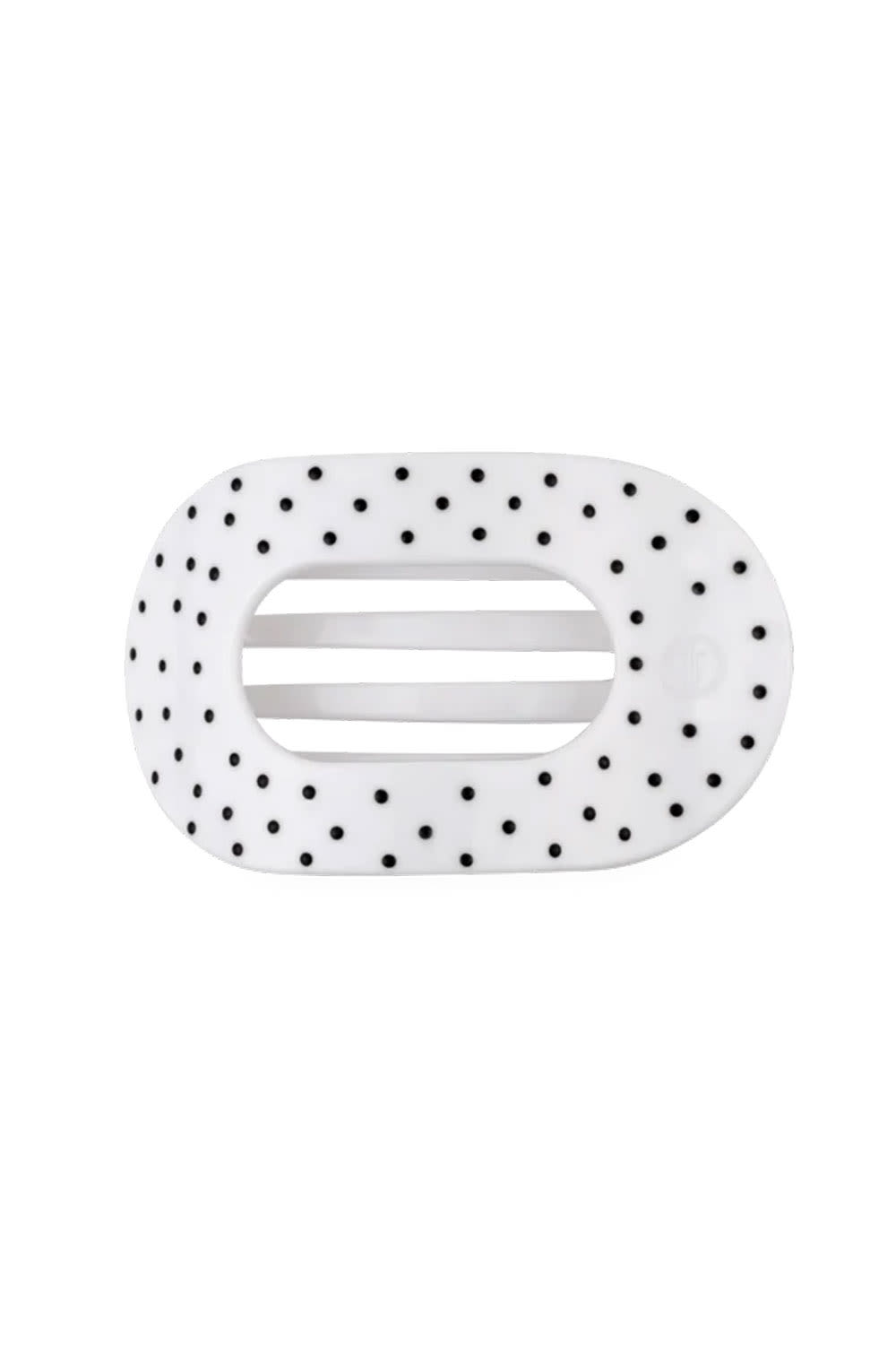 A white hair claw clip with a black polka dot pattern shown on a plain white background.