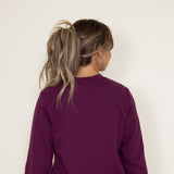 The North Face Heritage Patch Sweatshirt for Women in Boysenberry Red 