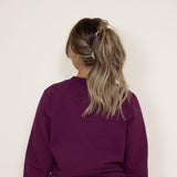 The North Face Heritage Patch Sweatshirt for Women in Boysenberry Red 