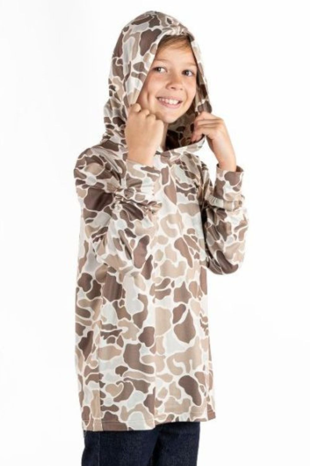 A child wearing a hooded long-sleeve top with an camouflage pattern in beige, brown, and off-white, posing against a plain white background.