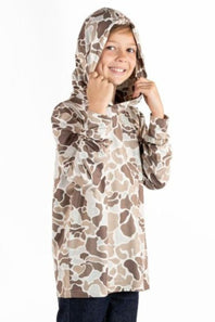 A child wearing a hooded long-sleeve top with an camouflage pattern in beige, brown, and off-white, posing against a plain white background.