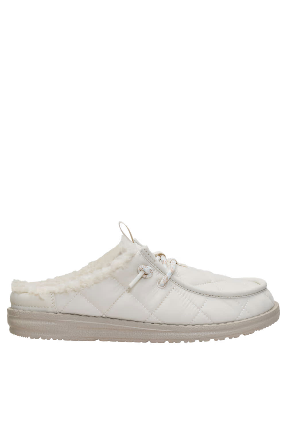 A white quilted slip-on mule shoe with a soft white faux-fur lining and a beige sole, shown in a side profile view against a plain white background.