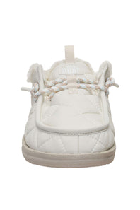 A white quilted slip-on shoe with faux fur trim, braided laces, and a pull tab, shown from the front on a white background.